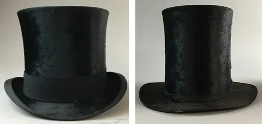 Two black top hats shown side by side on a plain background.